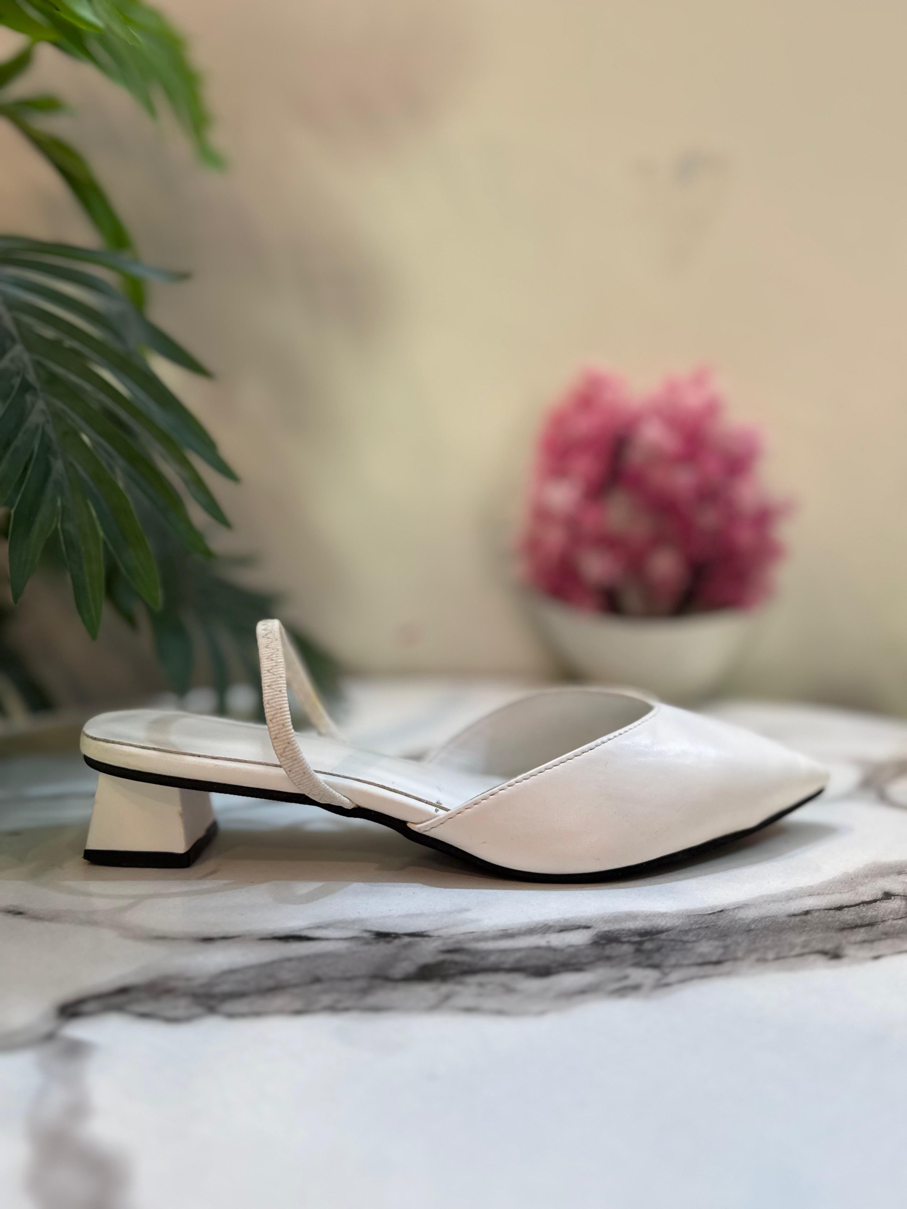 White sling bag heel