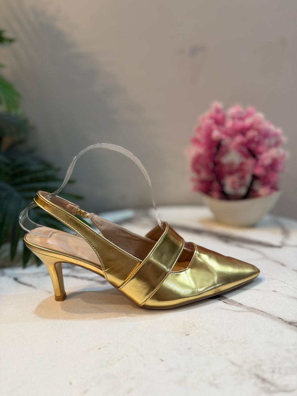 Golden sling back heel