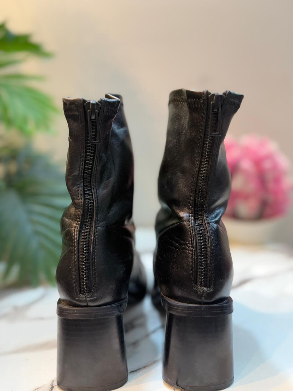 Black leather laceup boot with side zipper and golden buckle (Zara)