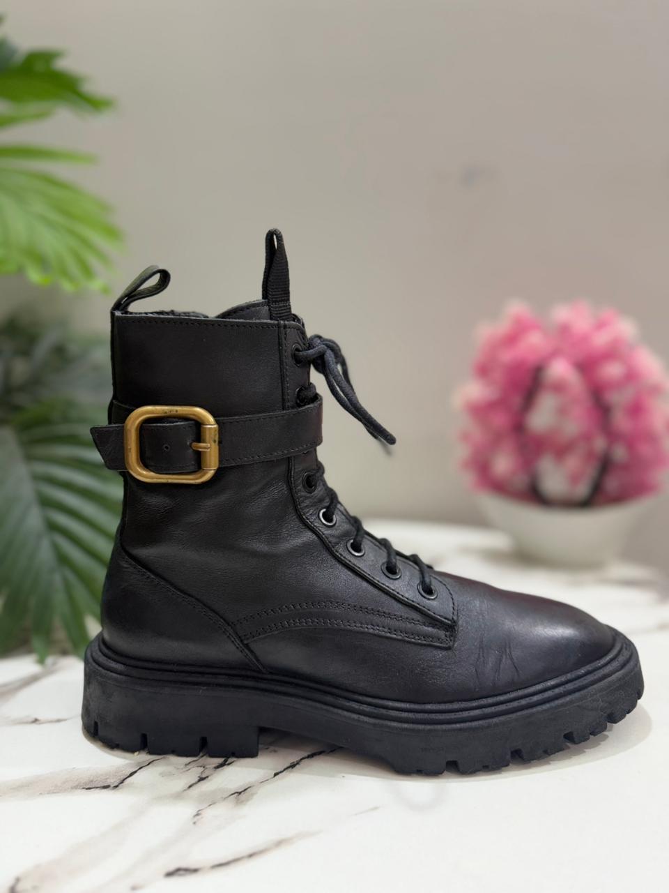 Black leather laceup boot with side zipper and golden buckle (Zara)