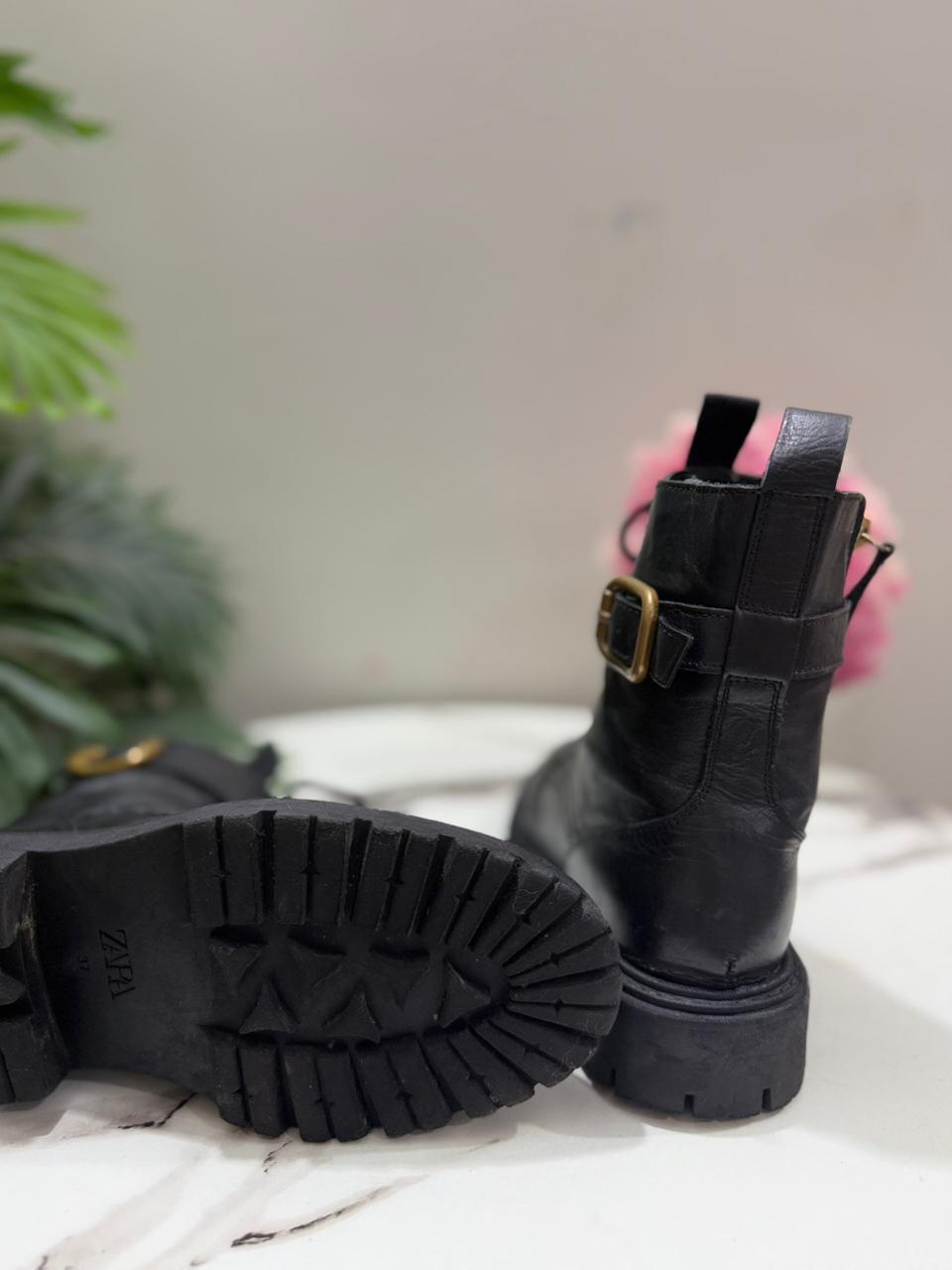 Black heeled laceup ankle boot with side zipper ( clara barson)